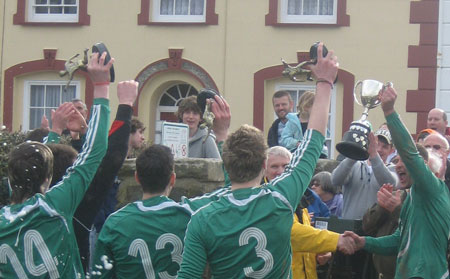 St DOgs lift the trophy
